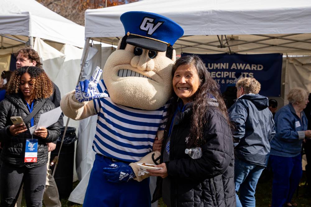 An alum with Louie the Laker.